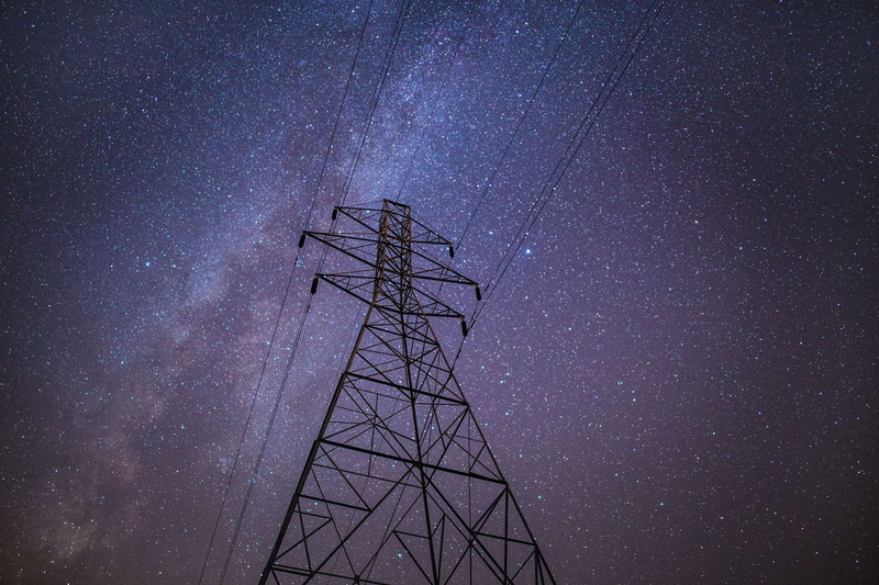 utility pole, space, no people, sky, built structure, scenics - nature, low angle view, power, connection, star, milky way, energy, star - space, nature