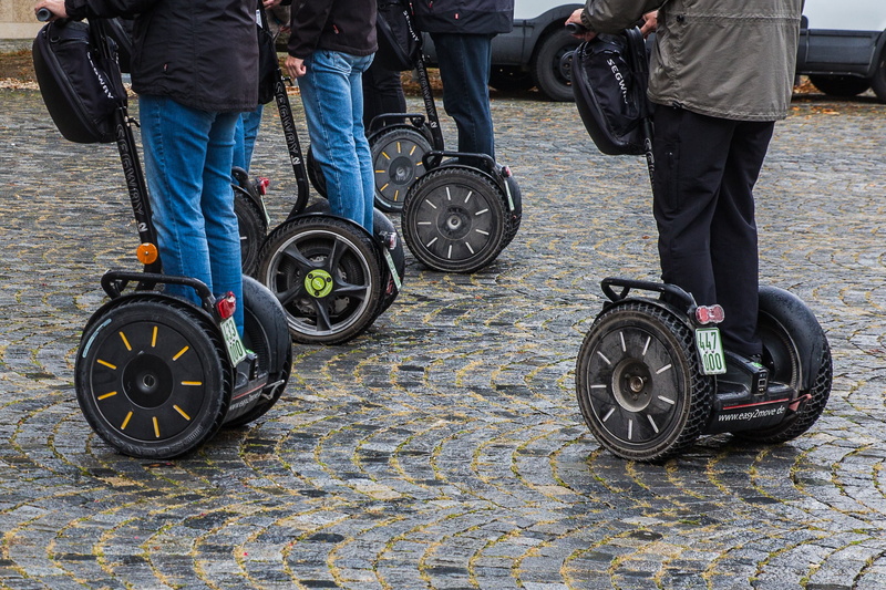 low section, trend-setting, transportation, roller, jeans, real people, holding, medical equipment, human limb, wheel, pt, outdoors, motor, environmental protection