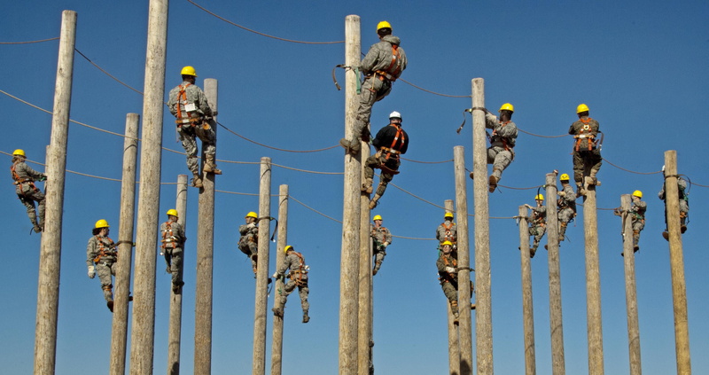 labor, wooden post, helmet, fuel and power generation, coveralls, no people, day, daytime, yellow, outdoors, pole, industry, electricity, wearing, training