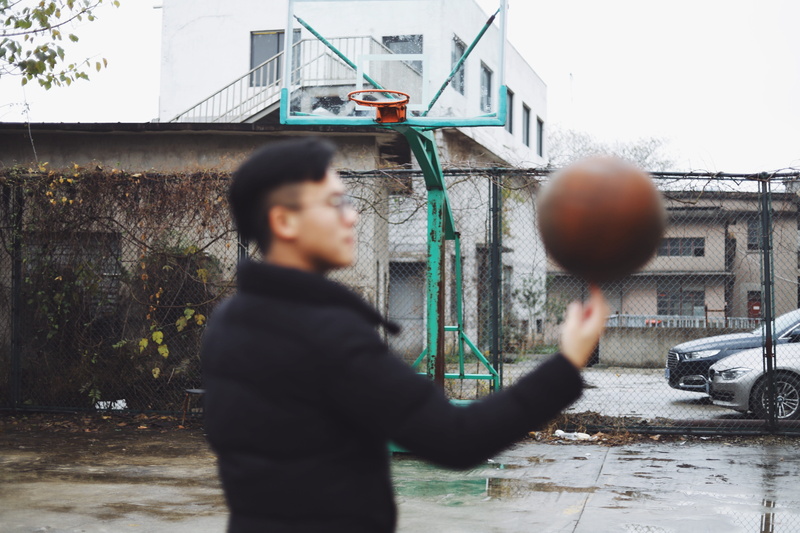 sphere, leisure activity, photography, human, hoop, sports, building exterior, team sport, people, sport, spinning, person, focus on background, transportation