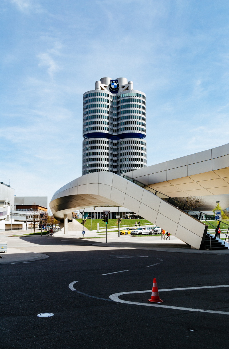 building, sky, munich, high rise, day, modern, concrete, orange cone, beside, skyscraper, built structure, nature, cloud - sky, marking, road, city, incidental people