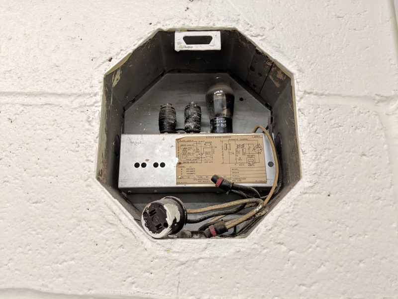 fuel and power generation, clock, cable, coin operated, text, lynn, power supply, connection, hole in the wall, old, built structure, telephone, wall - building feature