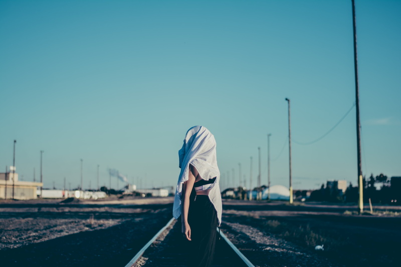obscured face, nature, lifestyles, track, leisure activity, three quarter length, woman, blue, women, casual clothing, day, daylight, architecture, standing