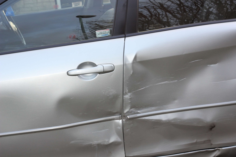 land vehicle, vehicle door, silver colored, day, car, transportation, transparent, outdoors, accident, crash, motor vehicle, white color, window, door