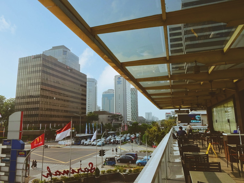 blue, modern, architecture, flag, mode of transportation, road, street, vehicle, outdoors, cloudy, nature, building exterior, real people, jakarta, incidental people