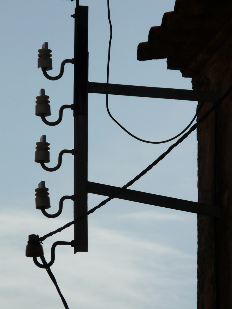cloud - sky, current, fixing, low angle view, metal, connection, communication, day, current flow, outdoors, power supply, sign, electricity, electrical conductors
