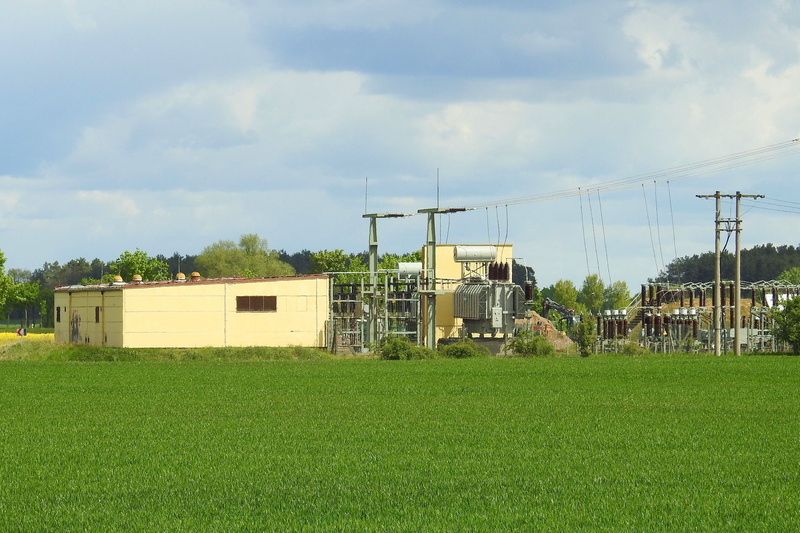 tree, building exterior, energy, cloud - sky, rural scene, electricity, field, high voltage, architecture, no people, built structure, landscape, day, nature