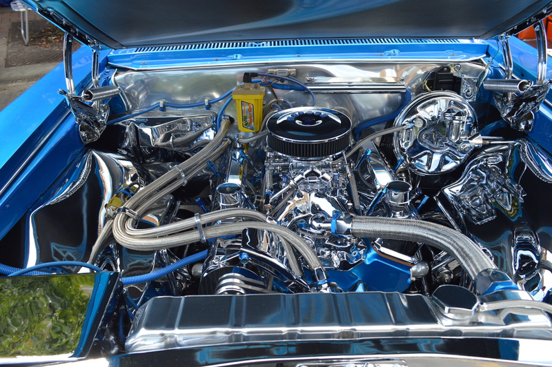 car show, race car, automobile, blue engine, steel, no people, motor vehicle, vehicle part, mechanic, headlight, power, bicycle, motorcycle, engine, land vehicle