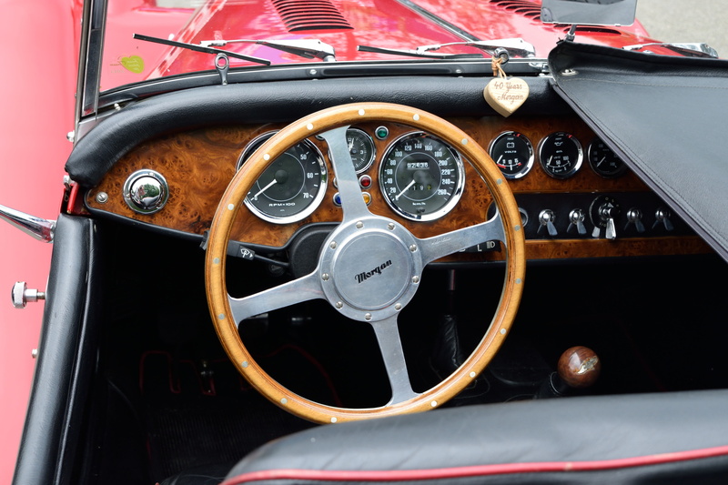 nautical vessel, mode of transportation, old, veteran, horsepower, polished, no people, land vehicle, classic, steering wheel, outdoors, vehicle interior