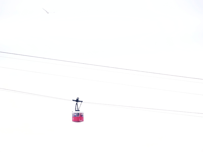 copy space, cable car, red, no people, lighting equipment, connection, outdoors, cable, low angle view, spain, transportation, technology, sky, overhead cable car