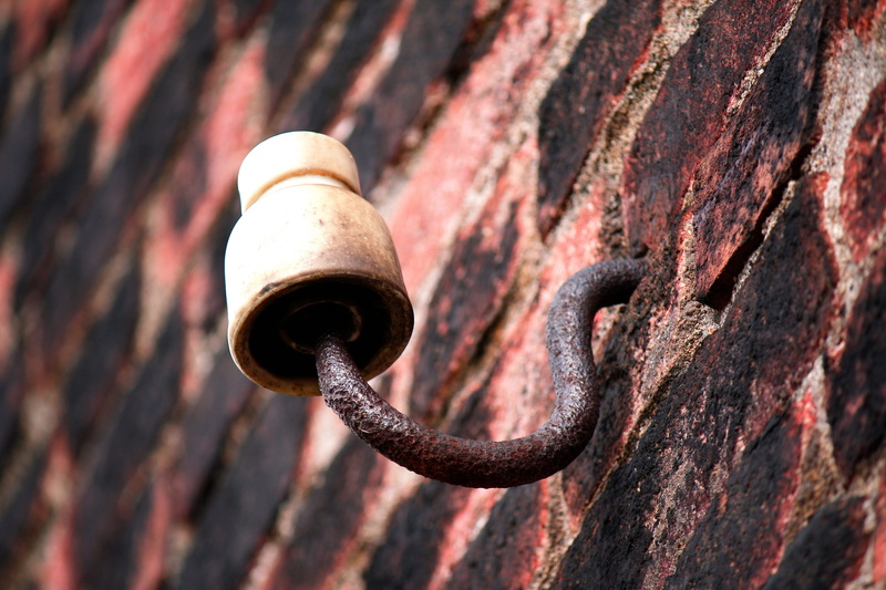 power connection, facade, pattern, power line, day, wall - building feature, no people, rusty, metal, security, brick wall, the past, sunlight, electricity