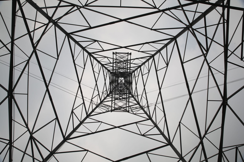 outdoors, electrical grid, no people, backgrounds, angle, architecture, 5K, directly below, technology, girder, built structure, transmission tower, metal