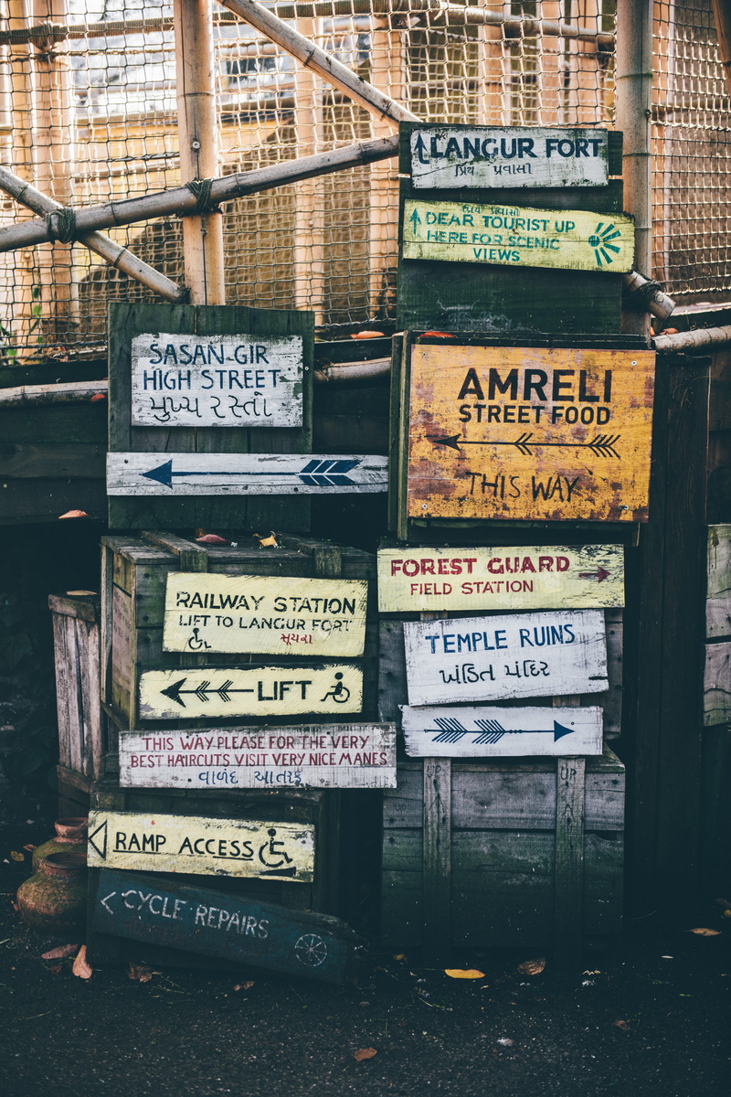 close-up, built structure, building exterior, outdoors, information sign, text, message, script, no people, guidance, assorted, high voltage sign, near