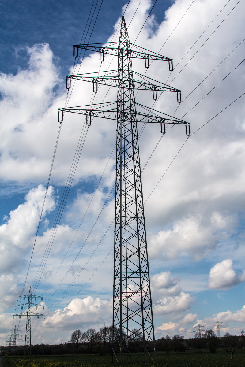 day, energy, cloud - sky, low angle view, tall - high, 4K, outdoors, power poles, no people, complexity, built structure, connection, cable, architecture