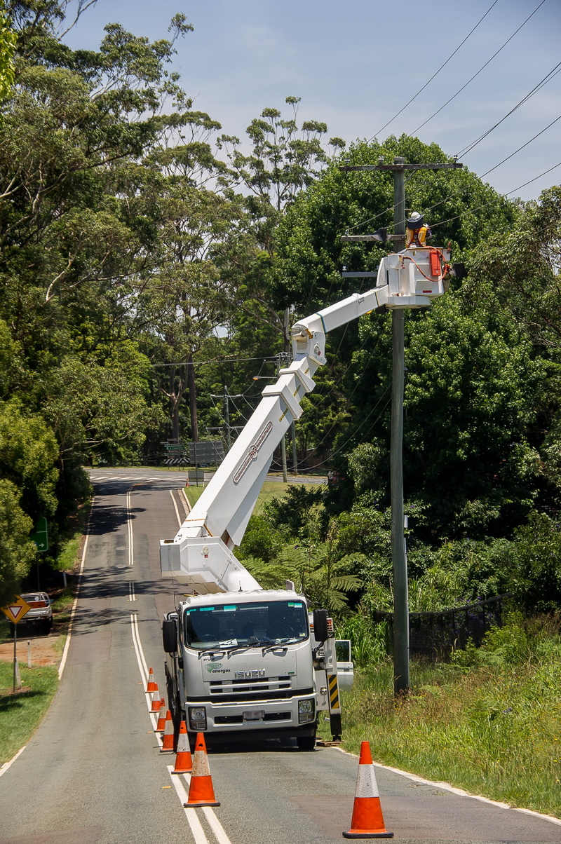 sky, industry, sign, cherry picker, pole, travel, car, Workers, nature, land vehicle, energy, sunlight, electric, growth, mode of transportation, outdoors