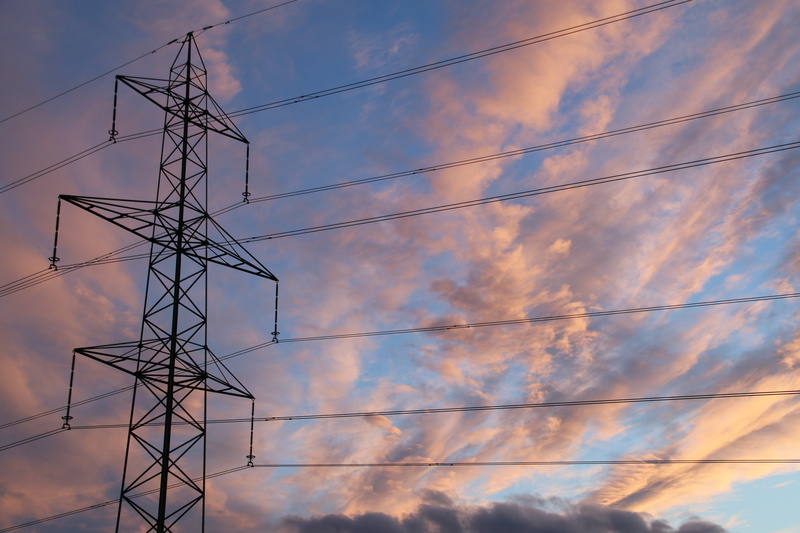 low angle view, electrical grid, day, power poles, cloud - sky, post, electronics, fuel and power generation, electrical component, metal, current, power supply