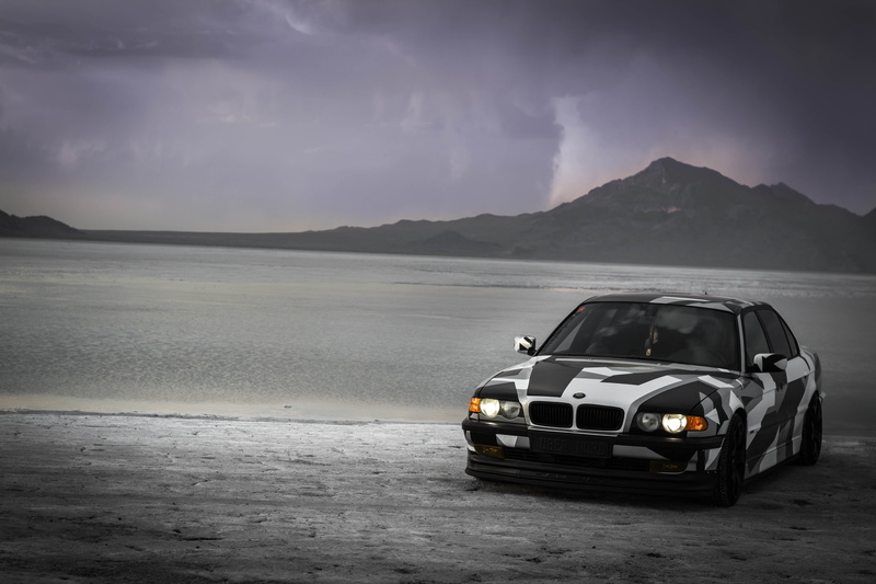 sand, 740il, land vehicle, non-urban scene, 5K, E38, sky, motor vehicle, Alpina, car, outdoors, sea, nature, camo, BMW, water, beauty in nature, road trip