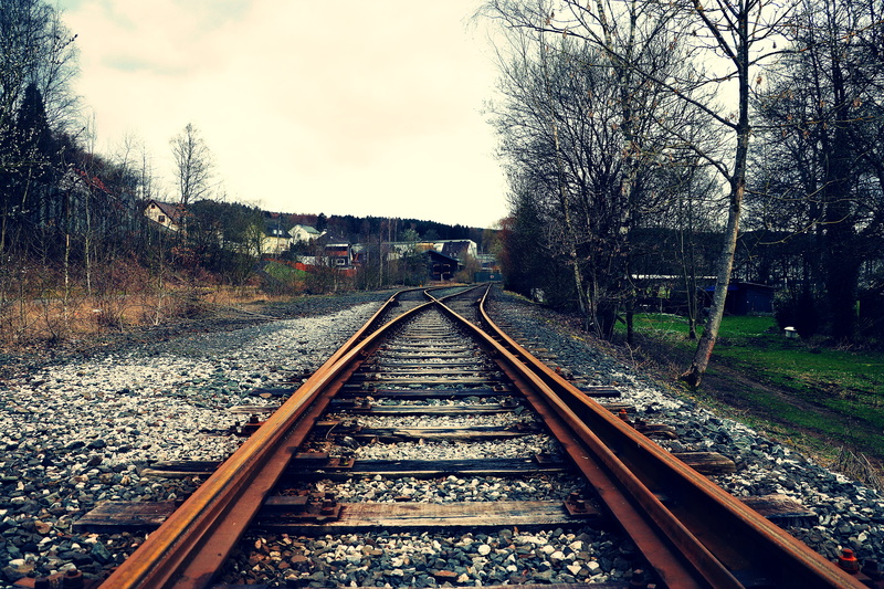 long, transportation, day, direction, cloud - sky, rail transportation, parallel, metal, factory, junction, no people, seemed, bare tree, sky, railroad tracks