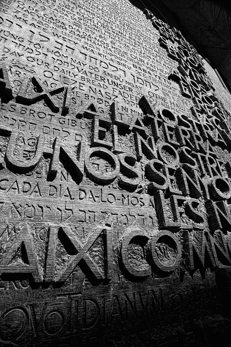 capital letter, close-up, message, history, low angle view, built structure, no people, creativity, our father door, sign, text, communication, day, art and craft