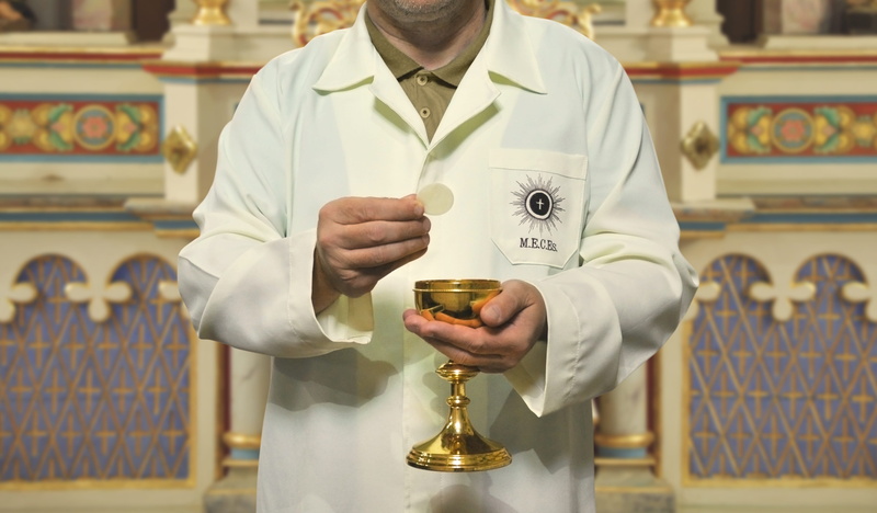 minister, faith, lifestyles, men, catholicism, holding, focus on foreground, adult, real people, occupation, leisure activity, white color, container, catholic
