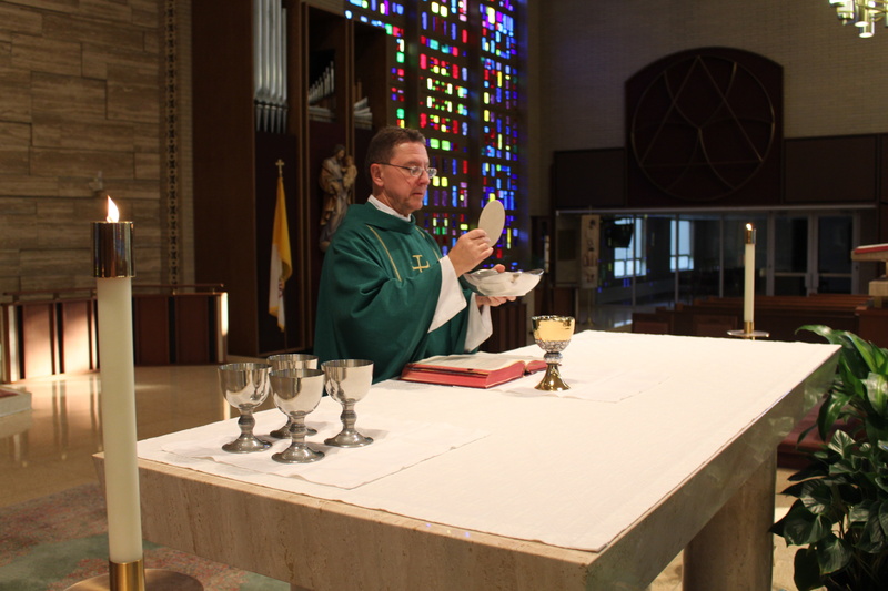 consecration, 5K, illuminated, people, leisure activity, sanctuary, concentration, casual clothing, restaurant, holding, lighting equipment, indoors, catholic mass