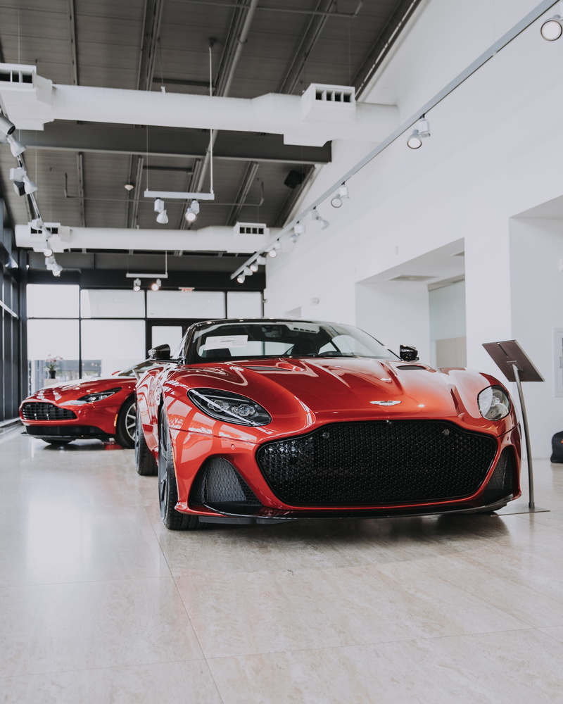 flooring, lifestyle, indoors, vehicle, coupe, motor racing track, shopping, sports, showroom, red, spoke, white color, consumerism, 4K, mode of transportation