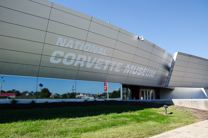 grass, business, building exterior, sky, outdoors, industry, education, sports car, entrance, national corvette museum, blue, architecture, built structure