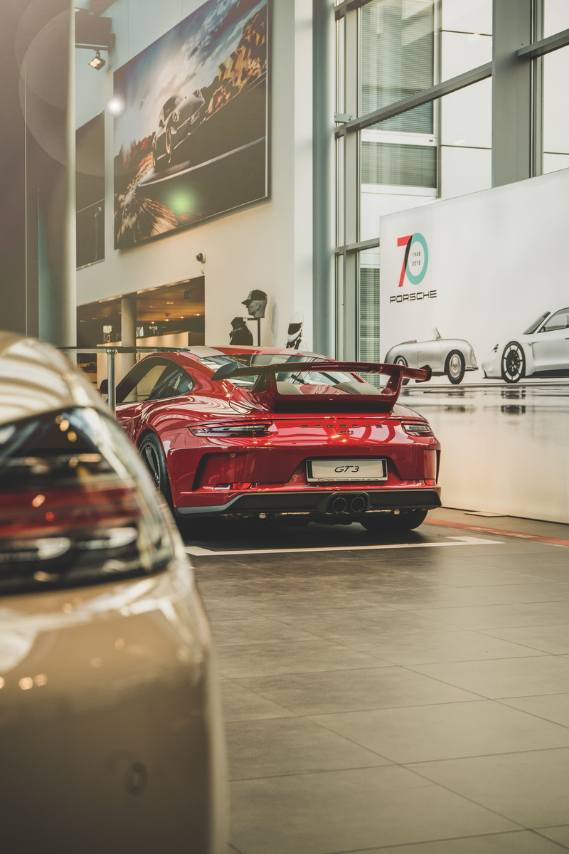 transparent, coupe, red, glass - material, car show, land vehicle, vehicle, machine, luxury, car, flooring, table, transportation, toy car, parking, garage