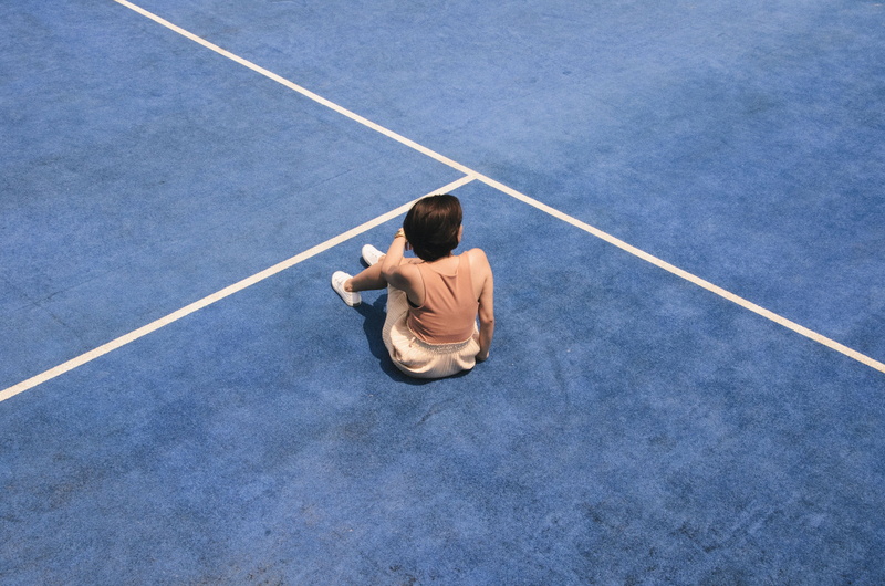 woman, floor, relaxation Exercise, athlete, back, outdoors, sports Training, sitting, court, line, young Adult, bright, japan, success, asian and Indian Ethnicities
