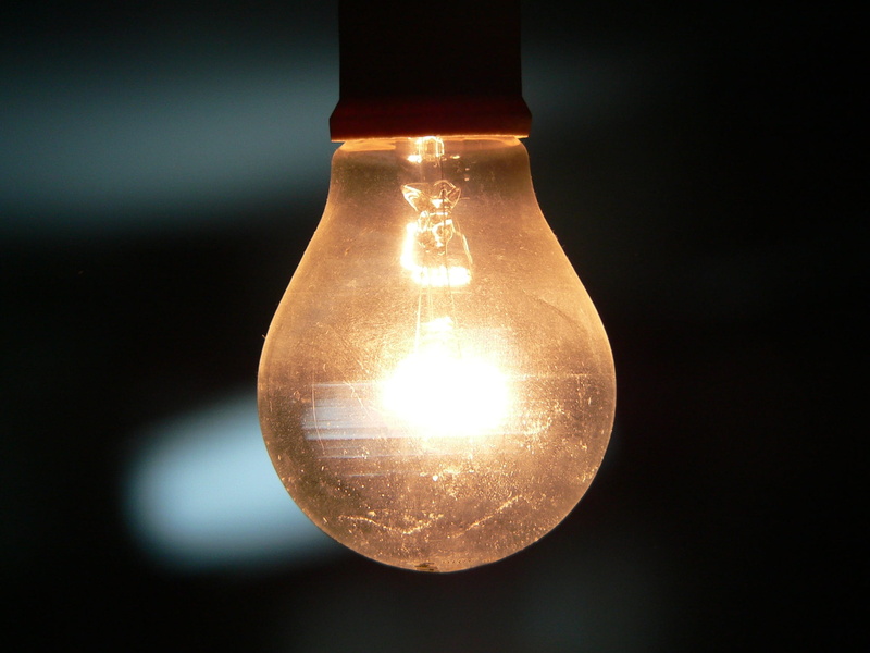 black background, bulb, dark, notion, lighting equipment, shell, single object, no people, fuel and power generation, focus on foreground, electric light