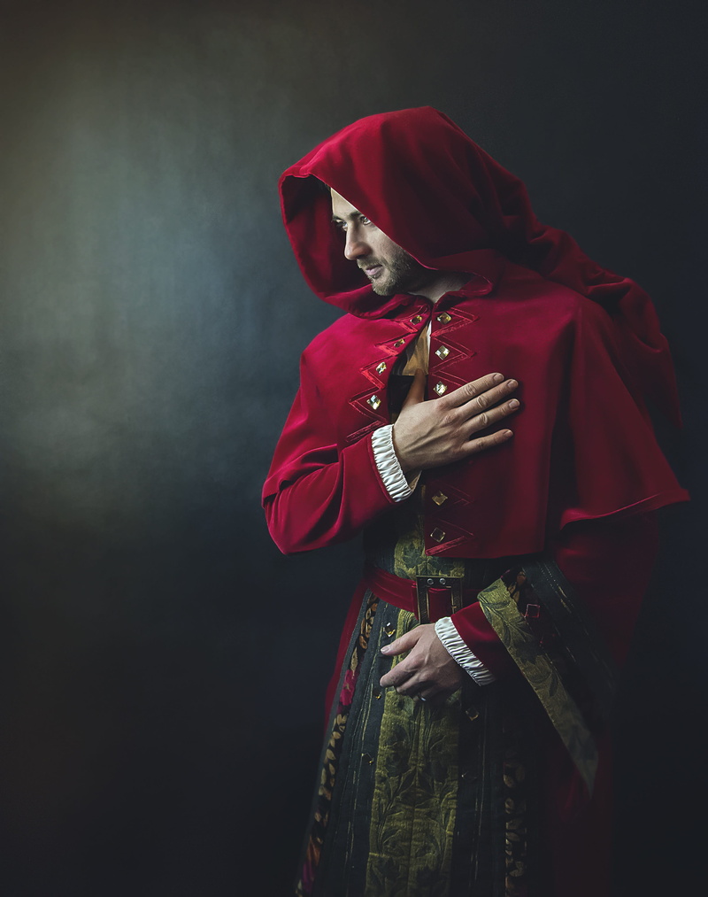 real people, knight, renaissance, lifestyles, hood - clothing, adult, holding, clothing, women, indoors, 4K, waist up, standing, hood, loyalty, religion