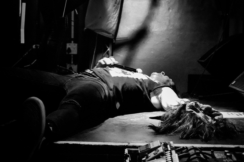 music, singer, working, blackwhite, indoors, angle, wig, rear view, rope, mask, holding, lying down, lying on back, relaxation, day, women, casual clothing
