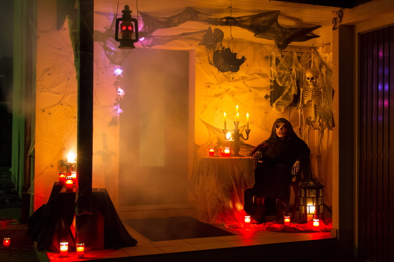 one person, scary, front view, sitting, full length, candle, indoors, fear, night, ghostly, 4K, illuminated, smoke - physical structure, religion, lighting equipment