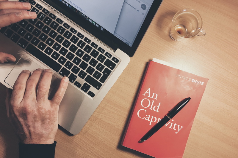 wood - material, laptop, businessman, people, human Hand, indoors, working, table, one Person, man, marketing, occupation, business Person, pen, furniture