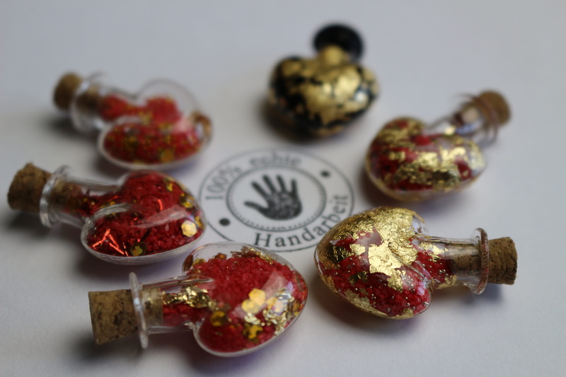 no people, group of objects, heart, gold, food, red, snack, hand labor, variation, medium group of objects, charm, bottle, selective focus, healthy eating