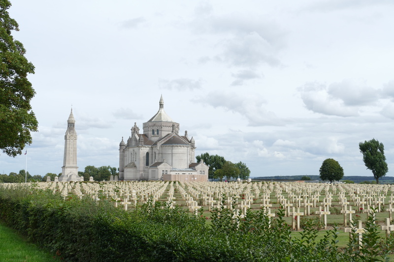cross, sky, commemoration, spire, cemetery, religion, monument, built structure, cloud - sky, belief, soldier, field, growth, building, day, architecture