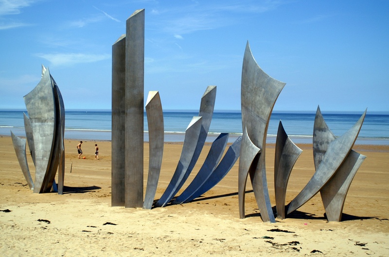 sky, daytime, nautical vessel, beach, sunlight, monument, normandy, coast, horizon over water, horizon, water, scenics - nature, sand, wood - material