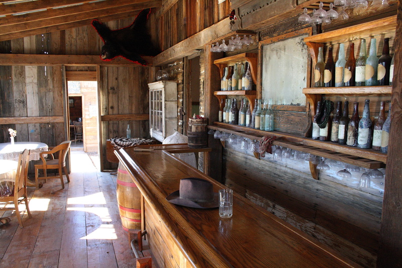 sunlight, shelf, ghost town, flooring, built structure, window, table, usa, wood - material, ceiling, roof beam, furniture, architecture, absence, no people