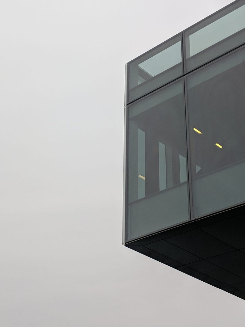banister, glass - material, copy space, cloudy, window shade, architecture, city, building exterior, outdoors, no people, shape, clear sky, home decor