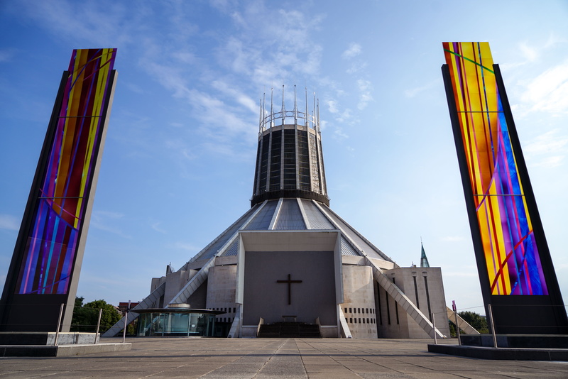 low angle view, travel destinations, church window, office building exterior, blue sky, built structure, skyscraper, cathedral, modern architecture, sky