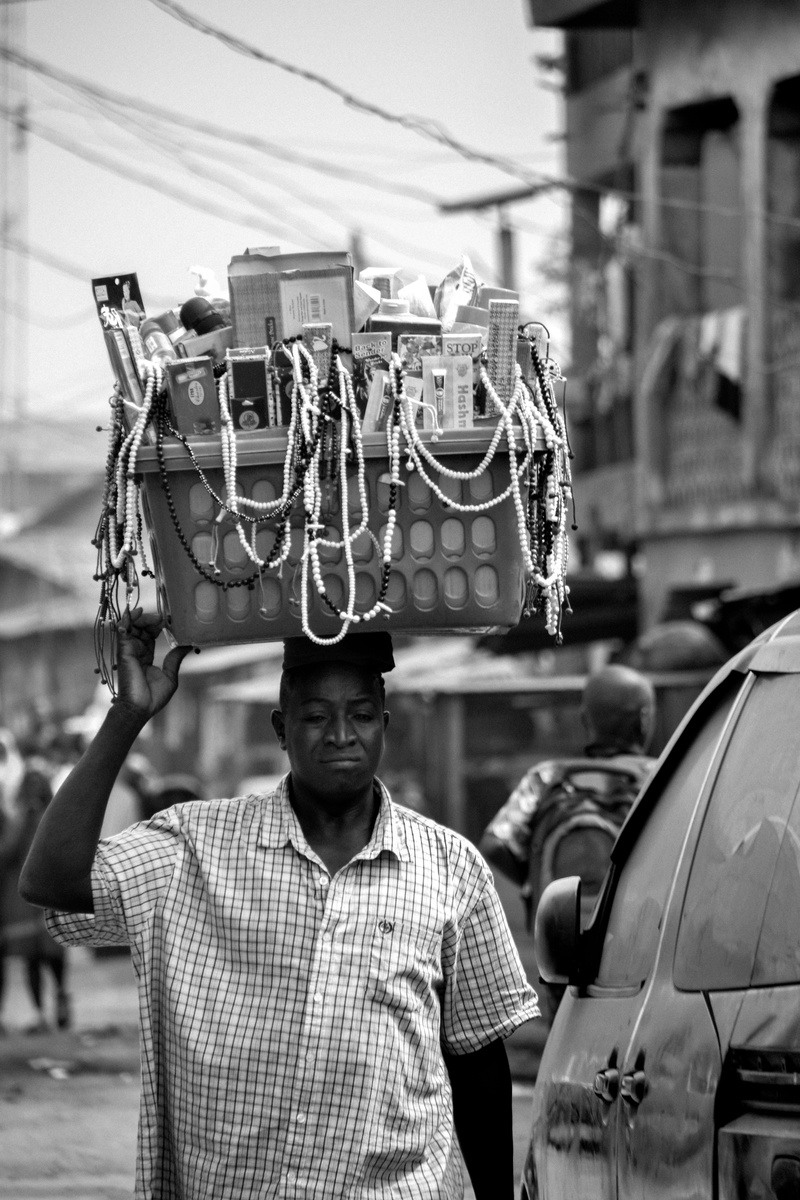 mode of transportation, incidental people, local, focus on foreground, 4K, selling, building exterior, buying, native, males, standing, front view, man