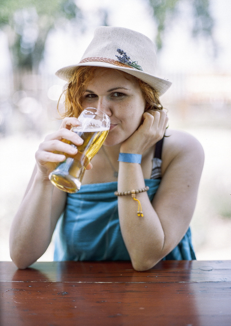 front view, person, holiday, mala, day, holding, lake, beach, hat, girl, food, hair, red hair, drinking, table, 5K, refreshment, portrait, fedora, leisure activity
