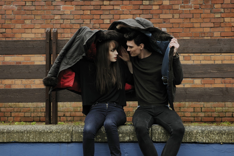protection, wear, weather, bench, 5K, brick wall, love, architecture, two people, city, clothing, young women, wall, covering, women, man, leather jacket