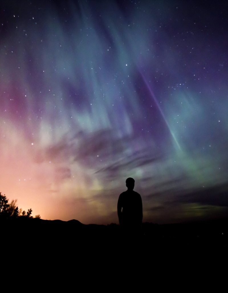 adults only, standing, lifestyles, atmosphere, people, sky, spirituality, one man only, men, tranquil scene, man, real people, magical, night, aurora, space