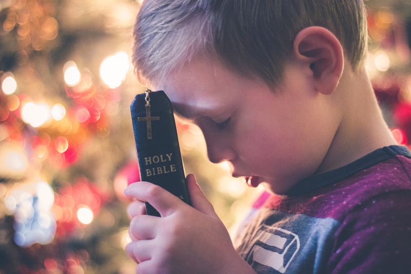 males, real people, night, boys, men, childhood, cross, photo, communication, offspring, headshot, looking, illuminated, hand, reading, kid, outdoors, praying