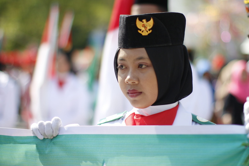 looking away, hairstyle, hijab, young, women, 5K, focus on foreground, human representation, front view, one person, looking, wear, uniform, moslem, outdoors
