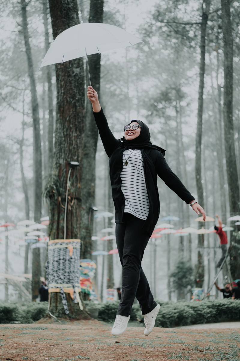 young adult, holding, warm clothing, full length, trees, bandung, one person, human arm, moslem, nature, arms raised, orchid forest cikole, rain, plant