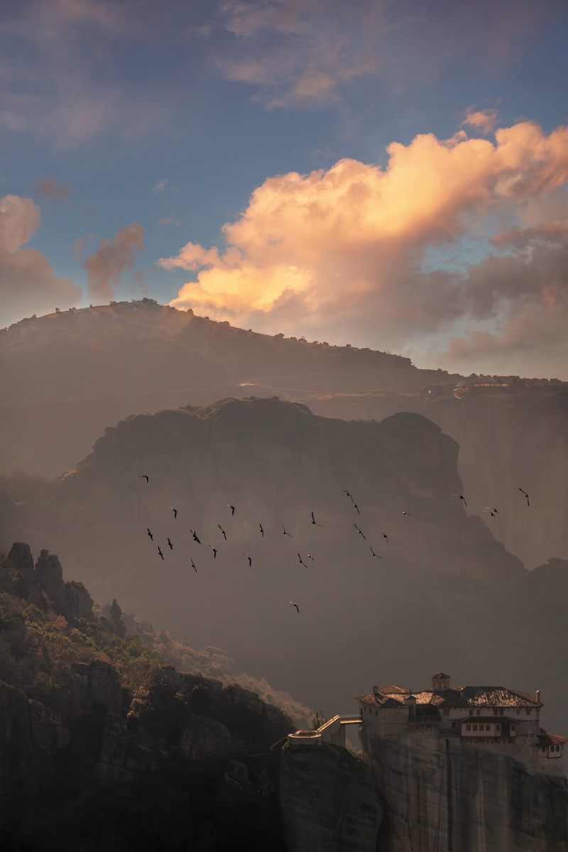 landmark, architecture, built structure, travel, outdoors, rock, sky, greek, sunset, landscape, tourism, no people, mountain, nature, bird, church, flock of birds