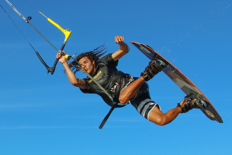 nature, casual clothing, kitesurfer, mid-air, jumping, motion, low angle view, wind, one person, 2K, kiteboard, kiteboarding, kitesurf, human arm, young adult