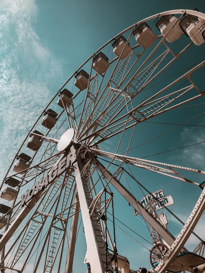sky, outdoors, silhouette, day, architecture, nature, plant, circle, person, built structure, cloud - sky, blue, ferris wheel, méxico, directly below, asphalt